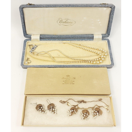 65 - A costume DELICIA faux pearl necklace within its original jeweller's presentation case with a fine u... 