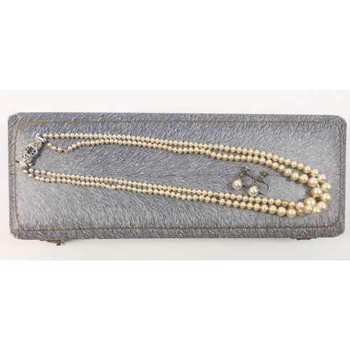 65 - A costume DELICIA faux pearl necklace within its original jeweller's presentation case with a fine u... 