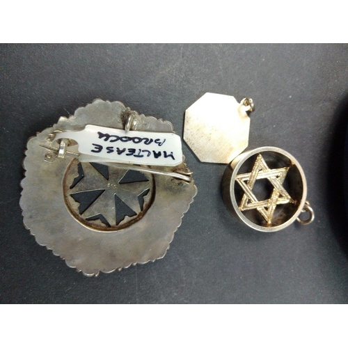 72 - A Maltese cross brooch 4cm diameter, a Star of David pendant 15mm diameter and a silver stamped Sagi... 