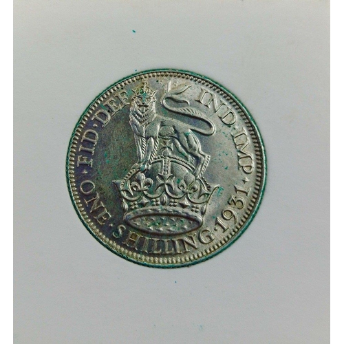 82L - An 1931 George V Shilling in high grade.  Lovely detail with clean fields does have some minor verdi... 