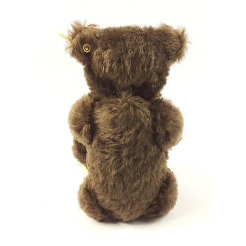 295 - A STEIFF 1920 Classic teddy bear with mohair fur, reference 000829, stands 25cm tall, with all label... 