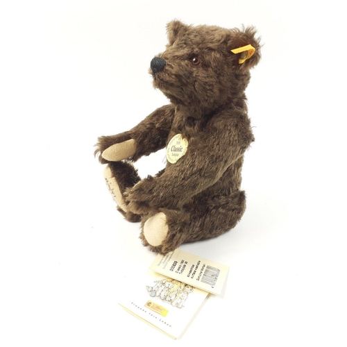 295 - A STEIFF 1920 Classic teddy bear with mohair fur, reference 000829, stands 25cm tall, with all label... 