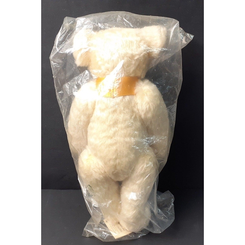 299 - A STEIFF white MILLENNIUM bear by Danbury Mint, reference 654701 standing 27cm high with mohair fur,... 