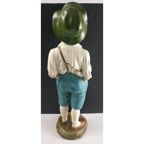 357 - An ART DECO chalkware whistling boy statue, stands approx 60cm tall.  Small chip from one toe but ge... 