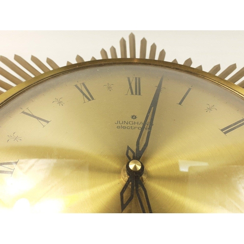 118 - A Junghans electronic ato-mat S German made sunburst clock with metal body. A substantial classy pie... 