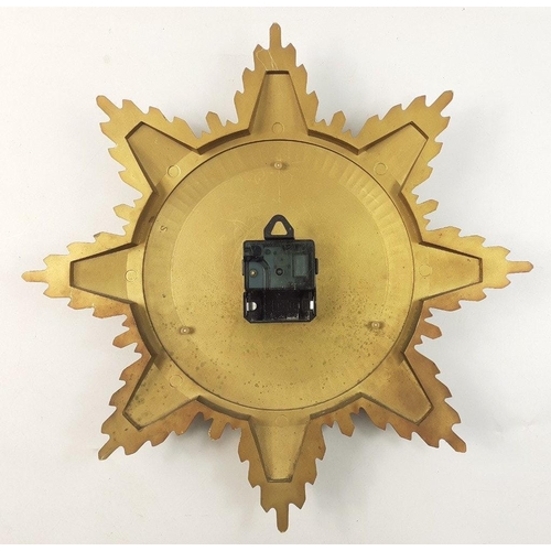 118 - A Junghans electronic ato-mat S German made sunburst clock with metal body. A substantial classy pie... 