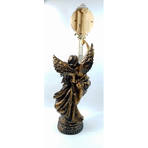 120 - A large ormolu style classical couple supporting a modern pendulum clock.  Stands an impressive 77cm... 