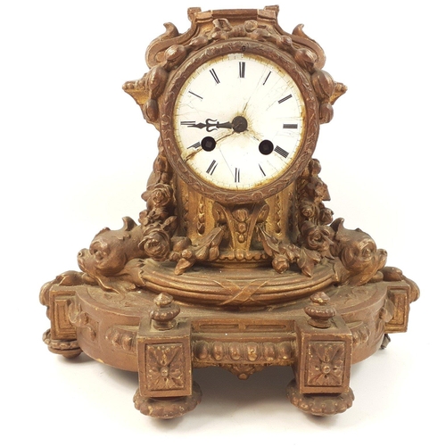 122 - A rococo mantel clock in need of restoration and missing finial 26cm high x 30cm at base#122