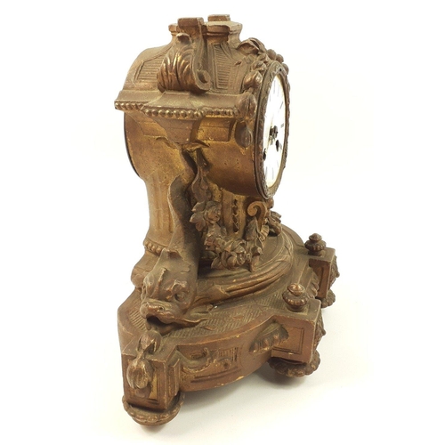 122 - A rococo mantel clock in need of restoration and missing finial 26cm high x 30cm at base#122