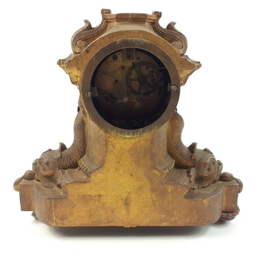 122 - A rococo mantel clock in need of restoration and missing finial 26cm high x 30cm at base#122