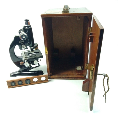 129 - A BECK of LONDON model 47 No. 27566 microscope in original wooden case with three additional lenses.... 