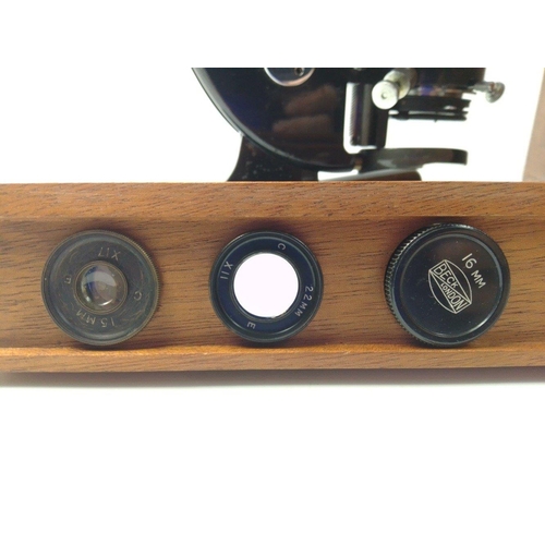 129 - A BECK of LONDON model 47 No. 27566 microscope in original wooden case with three additional lenses.... 