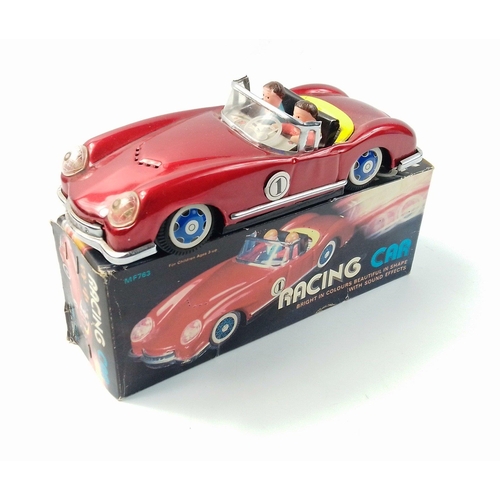 131 - A boxed tin plate racing car MF763#131