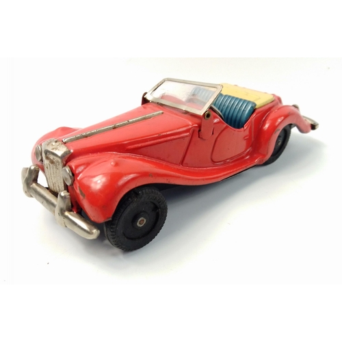 132 - A super antique foreign racing car made by BANDAI toys, unusually complete with bumpers, wheels and ... 