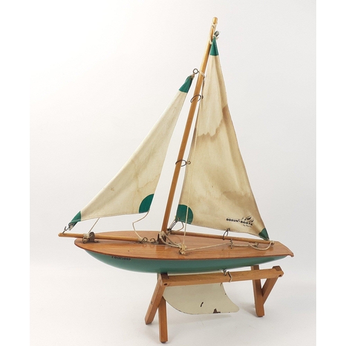 148 - A VINTAGE BOSUN BOATS by Reeves wooden model pond yacht named 'Fearless' on stand approx 40cm long#1... 