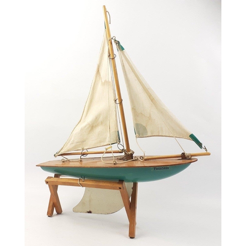 148 - A VINTAGE BOSUN BOATS by Reeves wooden model pond yacht named 'Fearless' on stand approx 40cm long#1... 