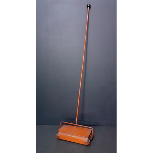 154 - A vintage child's manual carpet sweeper, total length 110cm#154