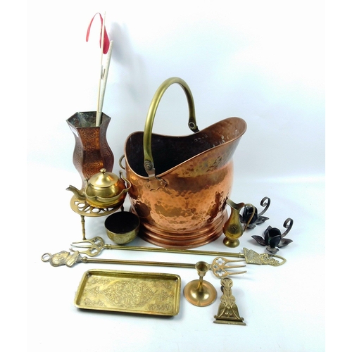 201 - A copper coal scuttle 28cm high, filled with copper and brass items including trivets, small teapots... 