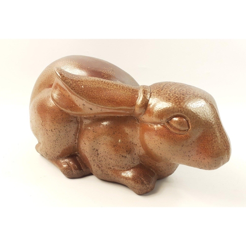 203 - A very attractive long-eared earthenware glazed rabbit, 33cm long#203