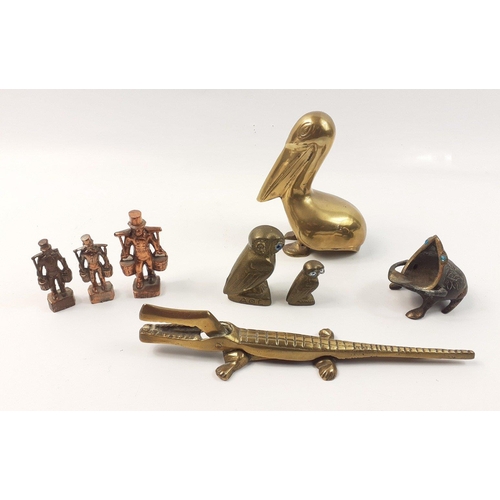 212 - A super collection of brass and copper decorative items to include a 12cm high pelican, a 20cm set o... 