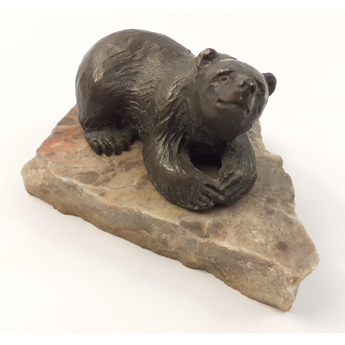 215 - A SIGGY PUCHTA limited edition (13/500) small bronze statue of a bear on marble base, base measures ... 