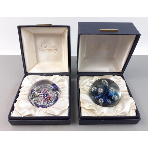 227 - Two boxed CAITHNESS paperweights. One a cane style.  Both in good condition.#228