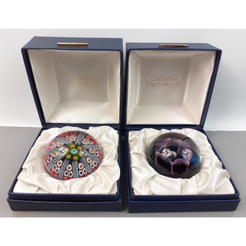 228 - Two boxed CAITHNESS paperweights. One a cane style.  Both in good condition.#229