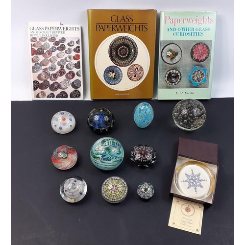 229 - A nice collection of eleven mainly Scottish paperweights in good condition along with three books on... 