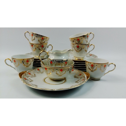 266 - A super tea set comprising 22cm sandwich plate, six side plates, six cups and saucers and a sugar an... 