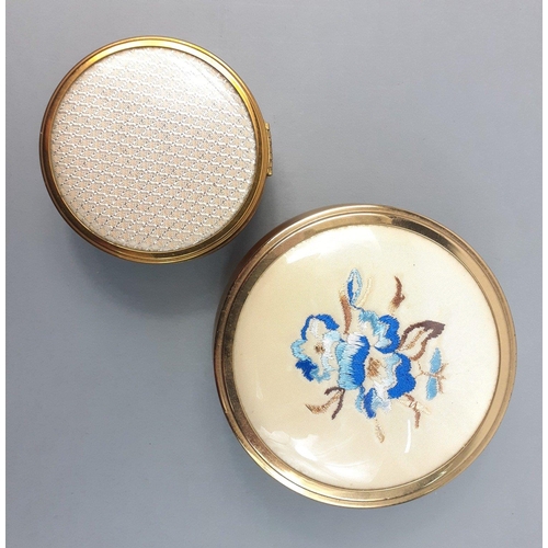 28 - A pretty pair of round dressing table gilt boxes, the larger being 10cm approx with an appealing sat... 