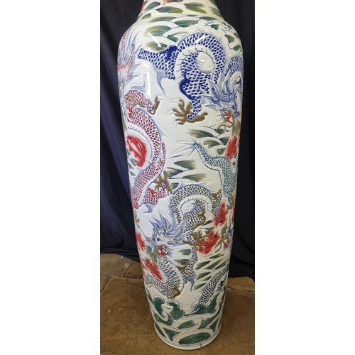 297 - An absolutely stunning original handmade porcelain vase which stands just over 7ft. The vase has gre... 