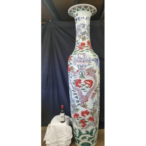 297 - An absolutely stunning original handmade porcelain vase which stands just over 7ft. The vase has gre... 