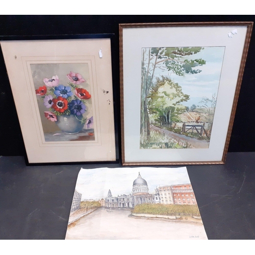 306 - Two framed and one unframed pictures, the largest a watercolour of a countryside scene, signed HA BA... 