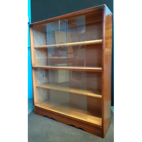 356 - A glass fronted dark-wood bookcase with sliding glass frontage H110xW90xD26cm#359