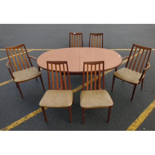 388 - Oval Fresco style G-PLAN table with leaf (W46cm), 4 dining chairs and 2 carver chairs. Upholstered i... 