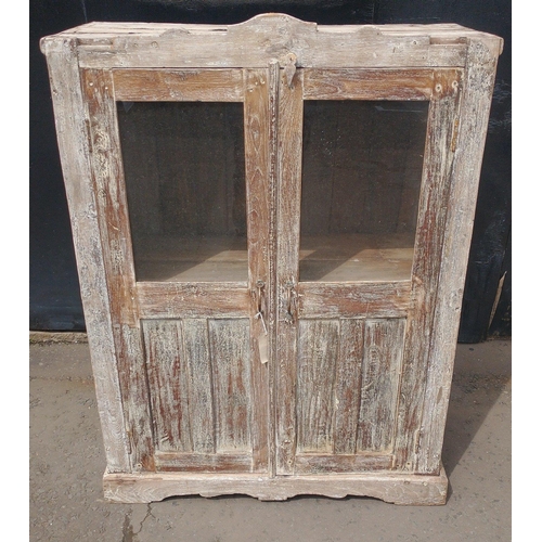 395 - An Indian white wood glazed cabinet with 2 shelves, 2 small drawers and partial glazed doors 114x90x... 