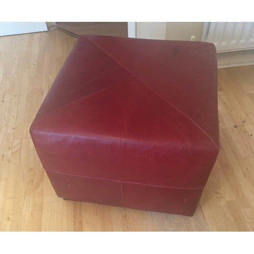 399 - Part of suite: A stylish RED LEATHER/HIDE armchair and footstool. This lot will be bypassed if full ... 