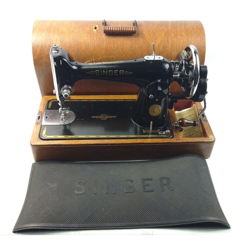 417 - A Singer sewing machine in a dome topped case, manual model with reg no.EB92003 (dating to 1938), li... 