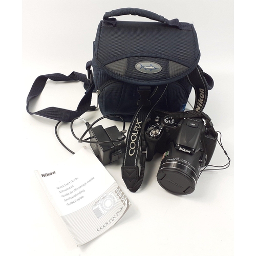 459 - A NIKON Coolpix P600 with battery charger and accessories in padded carry case#462