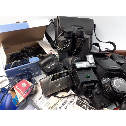 464 - A box of cameras and accessories to include a PENTAX Super A, Olympus Newpic XB, a ROLLEI 35, a YASH... 