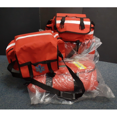 494 - A great collection of four medical kit bags to include two medical first aid bags, one with some fir... 