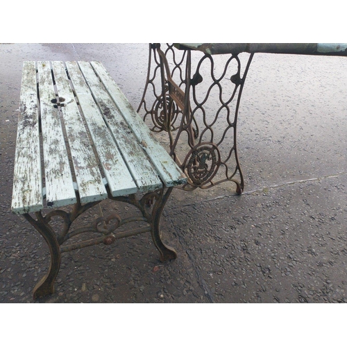 496 - Outdoor table and bench with wooden tops. Table with Singer treadle legs and bench with iron legs. T... 