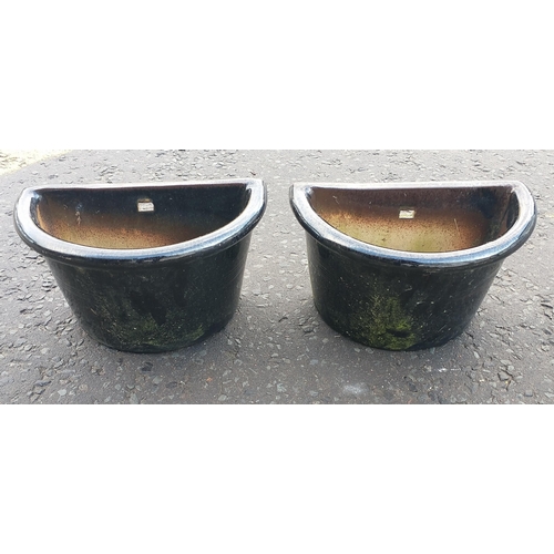 503 - Pair of black glazed half circle wall planters. Were hanging off a patio fence#506