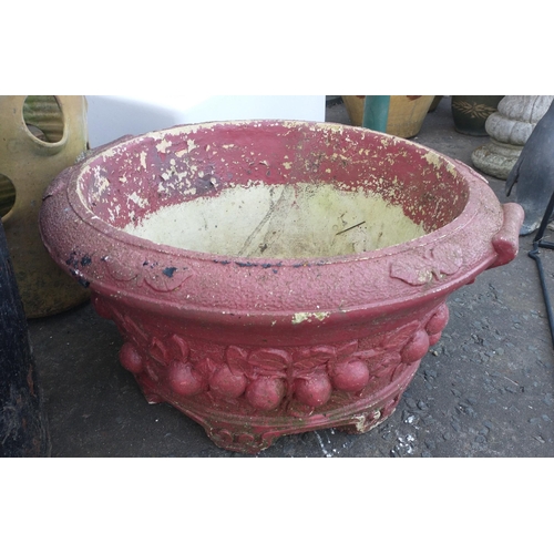 513 - A red-painted garden planter by WILLOWSTONE with embossed fruit design, W55cm#516