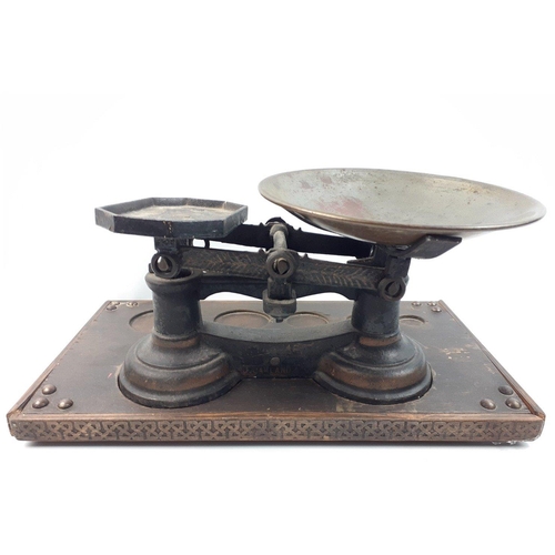 519 - A set of balance scales with pan by J GARLAND & CO set on a plinth with space for weights, base ... 