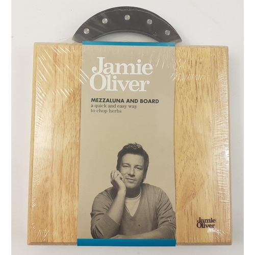 544 - A sealed JAMIE OLIVER Mezzaluna and board 22x22xm#547