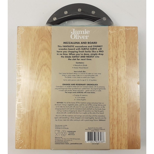 544 - A sealed JAMIE OLIVER Mezzaluna and board 22x22xm#547