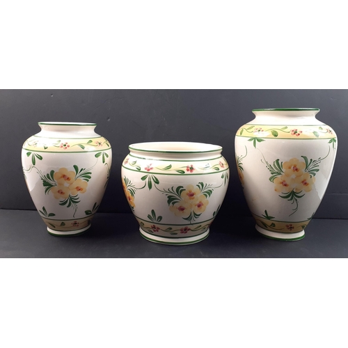 558 - A set of three attractive modern vases, the tallest being 25cm tall#561