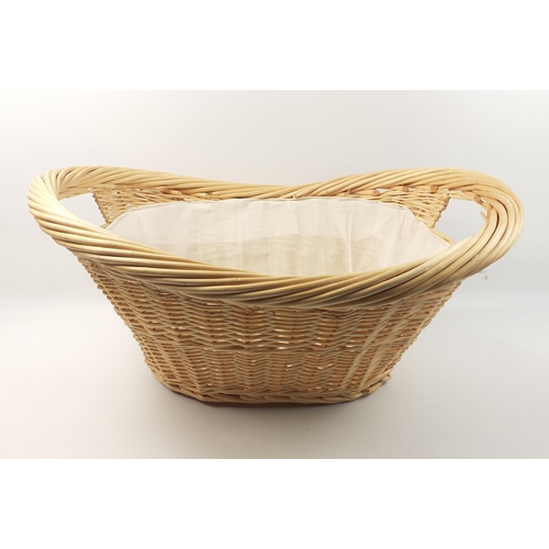 561 - A nice quality wicker twin-handled lined laundry basket in unused condition width 64cm approx#564... 