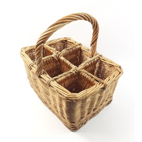 562 - A wicker basket sectioned to carry 6 bottles in safety#565